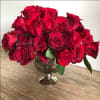 A modern twist on a classic. 2 dozen red roses in a
