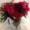 Grand arrangement of deep, rich red blooms including dahlias and roses