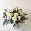 Bring these white roses and tulips with dusty miller, Christmas green, and