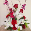 This beautiful arrangement comes with roses, carnations, butterflies, Casa Blanca lilies, daises