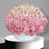 This arrangement comes in a round clay vase filled with filled with