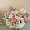 Get a beautiful, fresh medium sized Blomst arrangement of seasonal pastels or