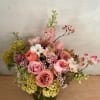 Get a beautiful, fresh medium sized Blomst arrangement of seasonal pastels or