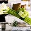 Perfectly angular white calla lilies, assorted succulent plant accents, and green hydrangeas