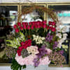 A stunning arrangement consisting of red roses, hydrangeas, spray roses, calla lilies