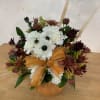 Made with white carnations, fall color mums, dry flowers and greenery.