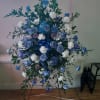 Stunning and unusual &quot;Blue Lagoon&quot; standing spray contains tinted blue roses, carnations
