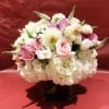 Custom arrangement of white hydrangea, roses, white tulips, altroemeria, Veronica, calla lilies