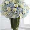 blue hydrangeas white roses  and calla lilies