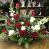 Red roses are featured here in a beautiful sympathy design perfect for
