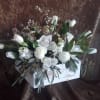 A bright collection of white blooms with a shabby chic feel. The