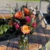 Show someone some love with this vase arrangement featuring roses and other