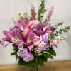 A touching tribute to a beloved woman, this beautiful, soft pink and