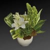This artistic arrangement includes white Asiatic lilies, green cushion spray chrysanthemums, bells