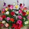 This beautiful arrangement comes with a mix of 36 colored roses. 