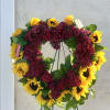 Express heartfelt thoughts with this stunning Sunflowers heart shaped standing wreath creates
