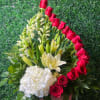 16 red roses, 
with white hydrangea
White Asiatic lilies 
White Snapdragons 