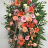  Standing Spray is an elegant display of sweet serenity.