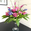 One dozen roses, tulips, veronica, hyacinth, pussy willow, and assorted greenery in