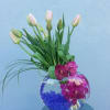 French Tulips if available Vanda Orchids,Bear Grass, colored Glass.