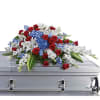 For a military or private funeral, this classic casket spray is a