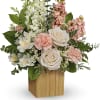 Celebrate your adoration with this artistic bouquet of creamy blooms and lush