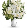 The gorgeous bouquet includes white roses, white spray roses, white oriental lilies