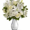 The gorgeous bouquet includes white roses, white spray roses, white oriental lilies