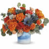 One of a kind! This standout mix of bold orange roses and