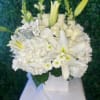 All white arrangement, white square ceramic vase. 
Hydrangeas, roses &amp; lilies with
