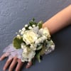 Choose classic white roses with baby&#039;s breath and mixed foliage that matches