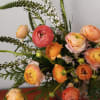 Bursting with birthday cheer!
This fun bouquet features peach ranunculus, burgundy snapdragon, assorted