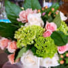 This delicate dreamy arrangement will make someone swoon. Pretty pink roses contrasted