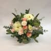 This low arrangement comes complete with light pink spray roses, white dahlias