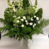 A lush blend of fern, curly willow,. queen anne&#039;s lace, and white