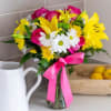 Make today a sunny one with this vibrant flower arrangement. The sunny