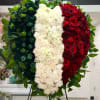 The heart shape wreath is adorned with the iconic colors of the