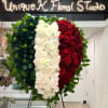 The heart shape wreath is adorned with the iconic colors of the