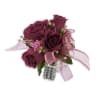 Fuchsia pink roses and kalanchoe blooms are accented with rhinestones and beautiful