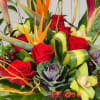 Birds of paradise, Hawaiian ginger flowers, ornamental kale, roses, and orchids appeared