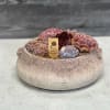 A balanced succulent arrangement with 2 crystals in a concrete bowl shaped
