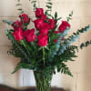 Dozen red roses in a beautiful luxury vase