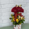 This is a beautiful topiary made with roses, greenery and a delightful