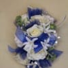 delicate flowers placed in a wrister of royal blue
