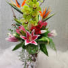 Includes Cymbidium, Birds of paradise, Stargazer lilies, Protea, Roses, pussy willow and