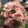 A Soft mix of pink roses, pink spray roses, pink alstroemeria, wax