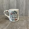 Beautiful arrangement in a ceramic mug saying Make Today Amazing. 
