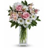 With soft pink carnations, light pink alstroemeria, white daisies and glossy green