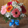 An all around bouquet of Gerbera Daisies in a fashionalble vase with