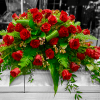This beautiful casket spray is composed of 4 dozen Red Rose blooms